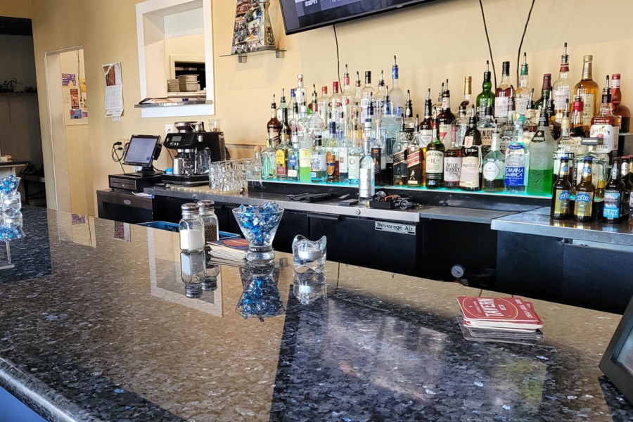 Serving Greek wines, beers, Ouzo, Metaxa, and 
                other spirits.